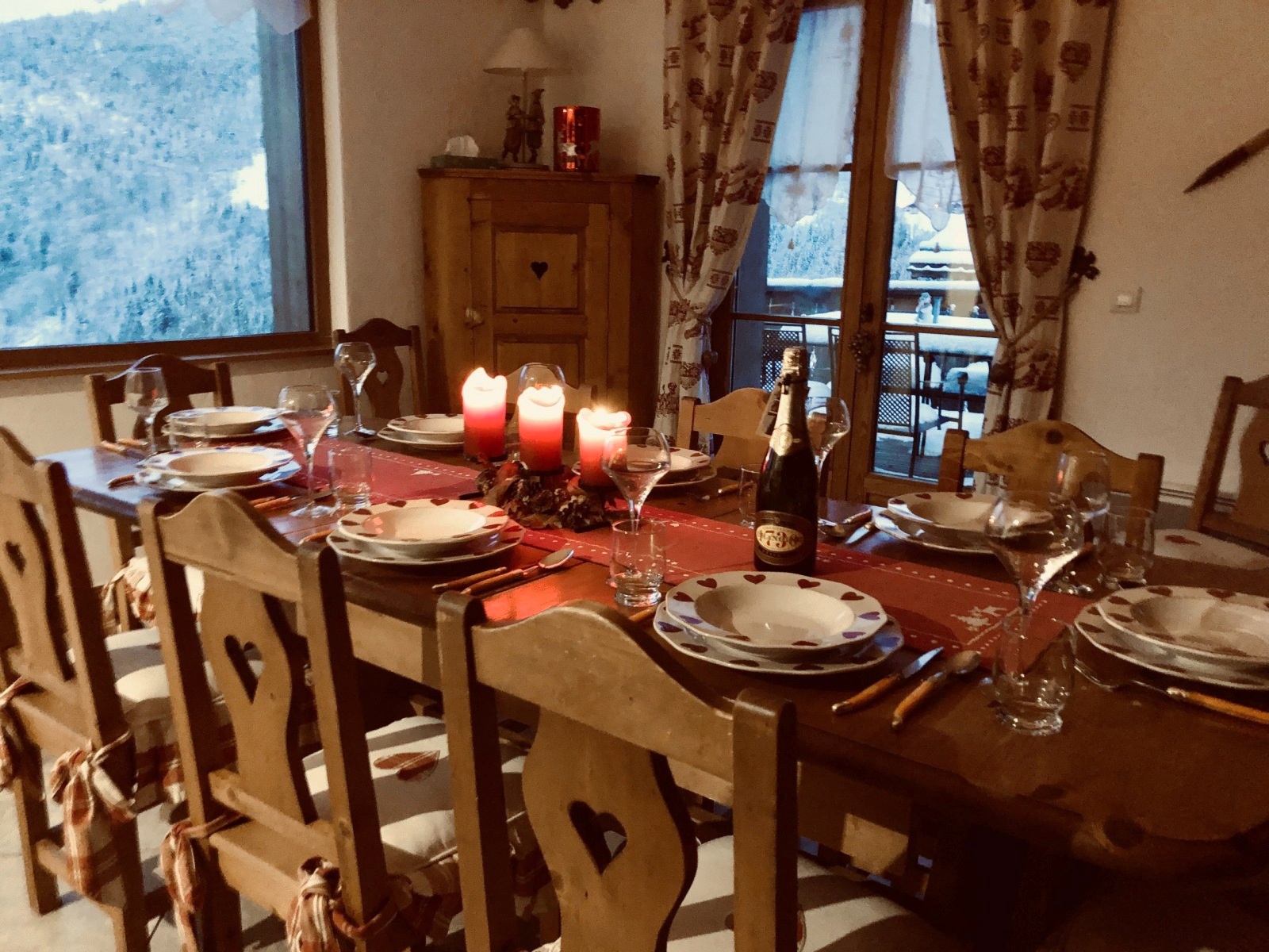 The chalet's wooden dining table, ready for a meal together